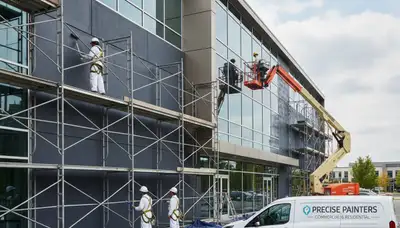 Professional commercial painters finishing office exterior in Burlington, MA