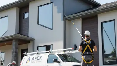 Professional gutter painting on Burlington, MA home exterior by local house painting experts