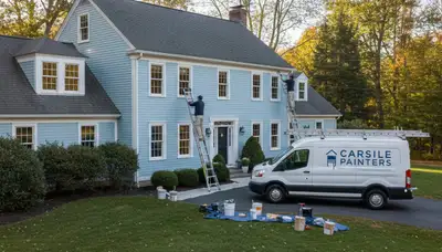Professional house painters working on exterior home in Burlington MA