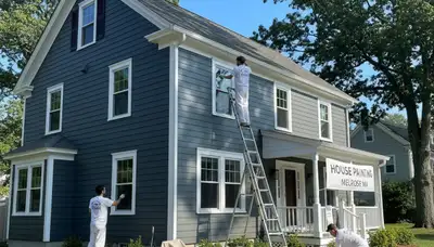 Professional house painters working on residential exterior in Burlington MA