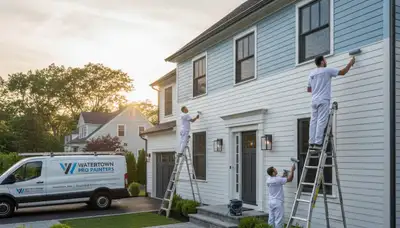 Professional house painters working on exterior home in Burlington MA