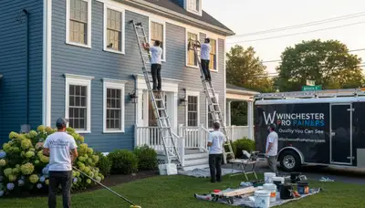 Professional house painters in Burlington MA painting exterior home siding with smooth finish