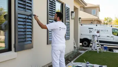 Professional shutter painting on a Burlington, MA home with fresh, weather-resistant finish
